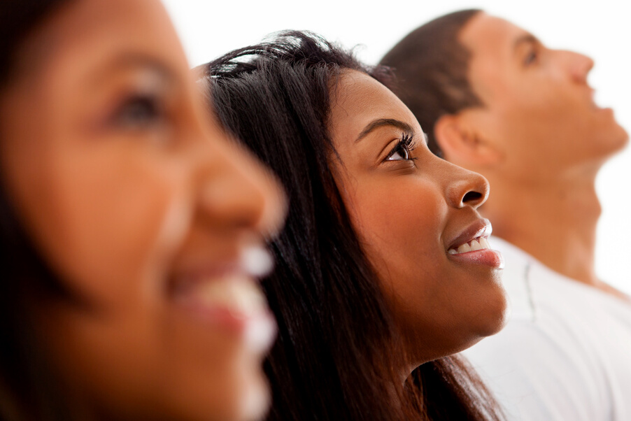 Group of black people in a row smiling - Profile view